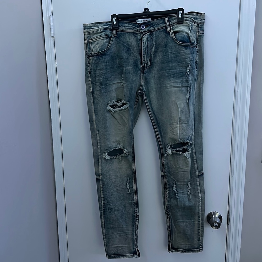 Ripped light-wash jeans by fashion nova mean